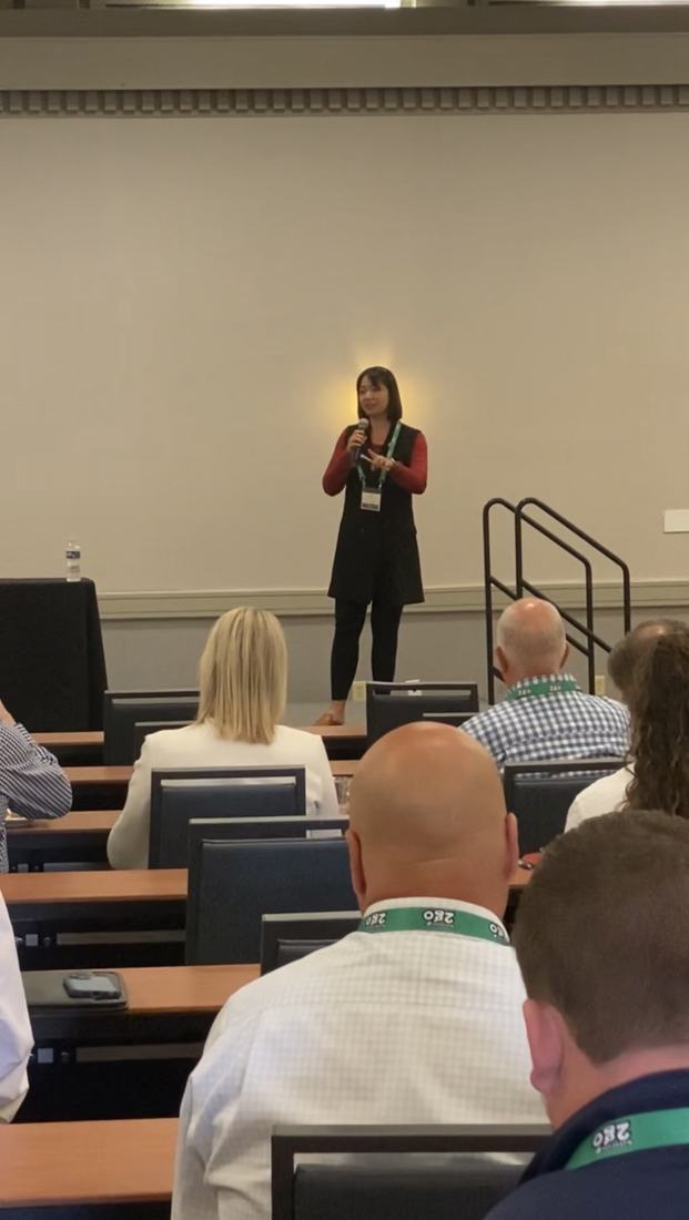 Claudia speaking to franchise executives in the United States