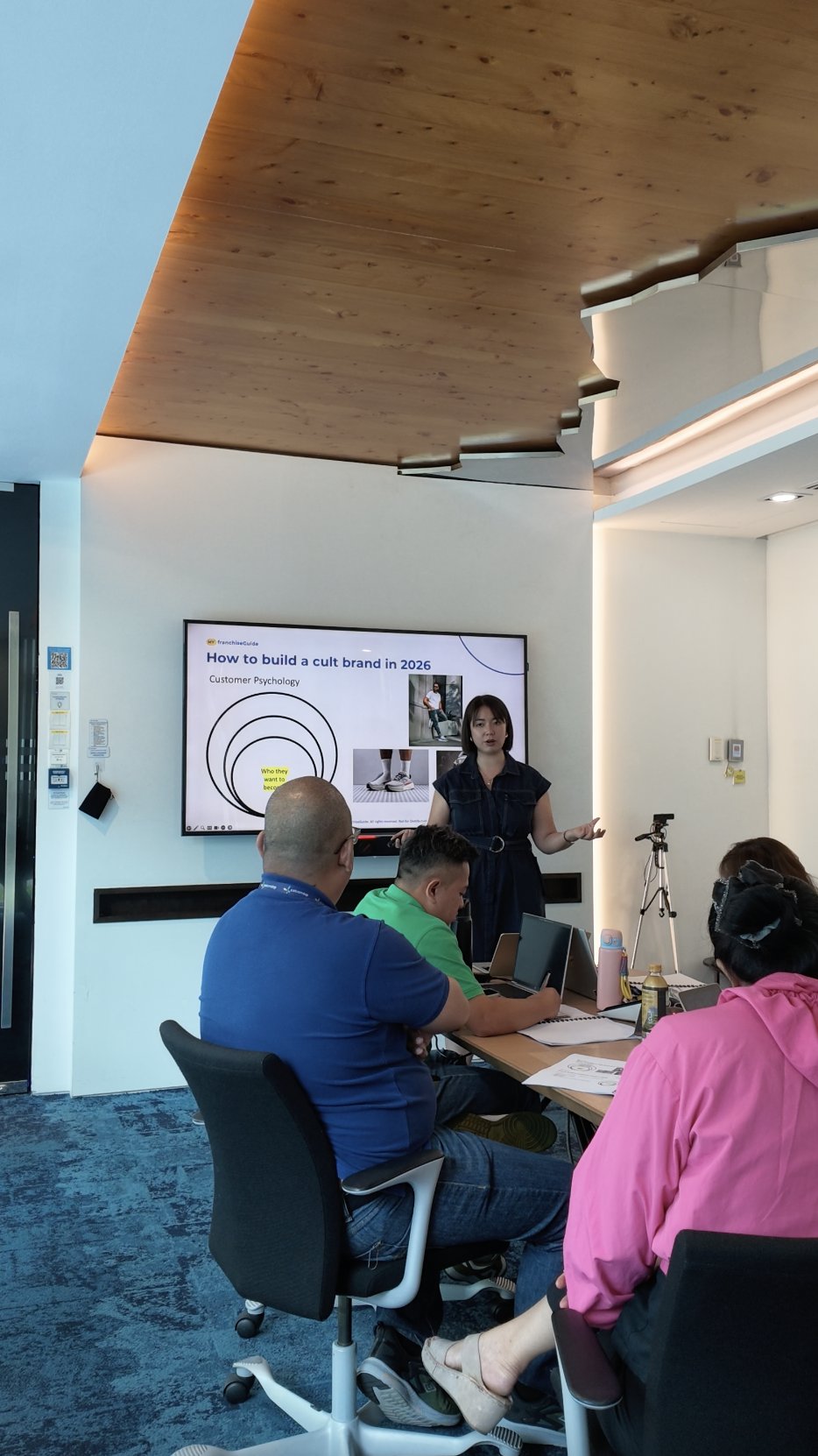 Claudia Ng teaching a MYFG Academy training session on brand positioning