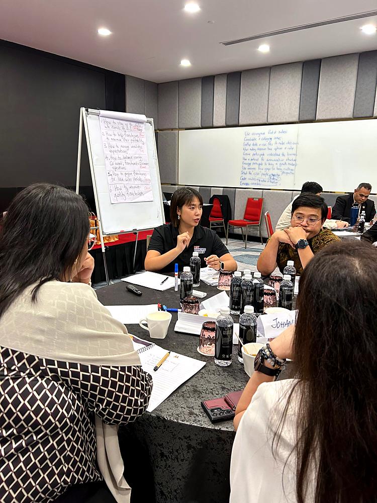 Claudia facilitating a roundtable discussion in Malaysia